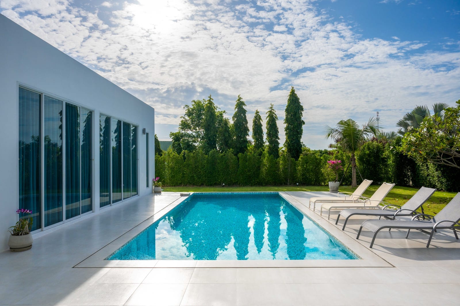 Pool chairs by a pool house for a pool service billing mistakes post
