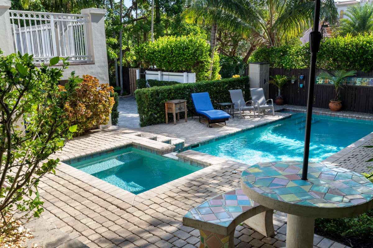 Lush garden with trees and a pool creating a calm, harmonious atmosphere
