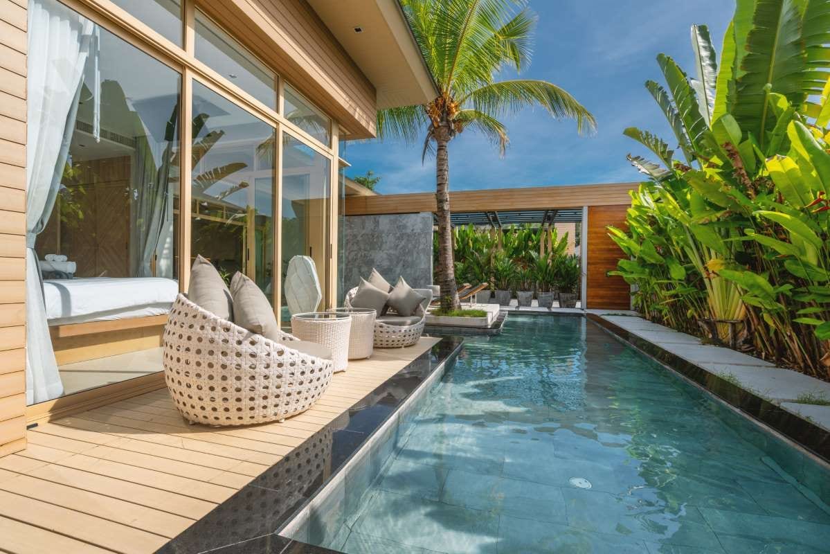 Luxury villa interior with bedroom and swimming pool view