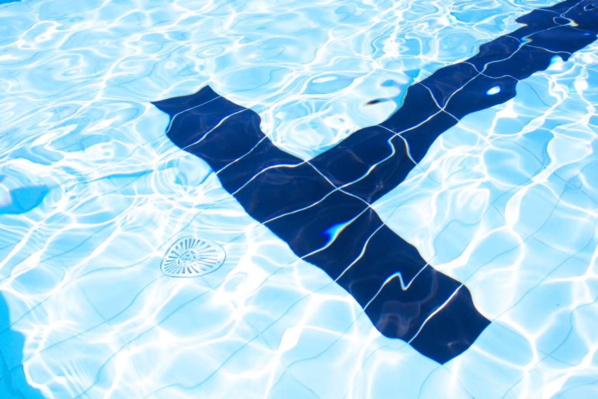 Man swimming in a pool, low-angle view