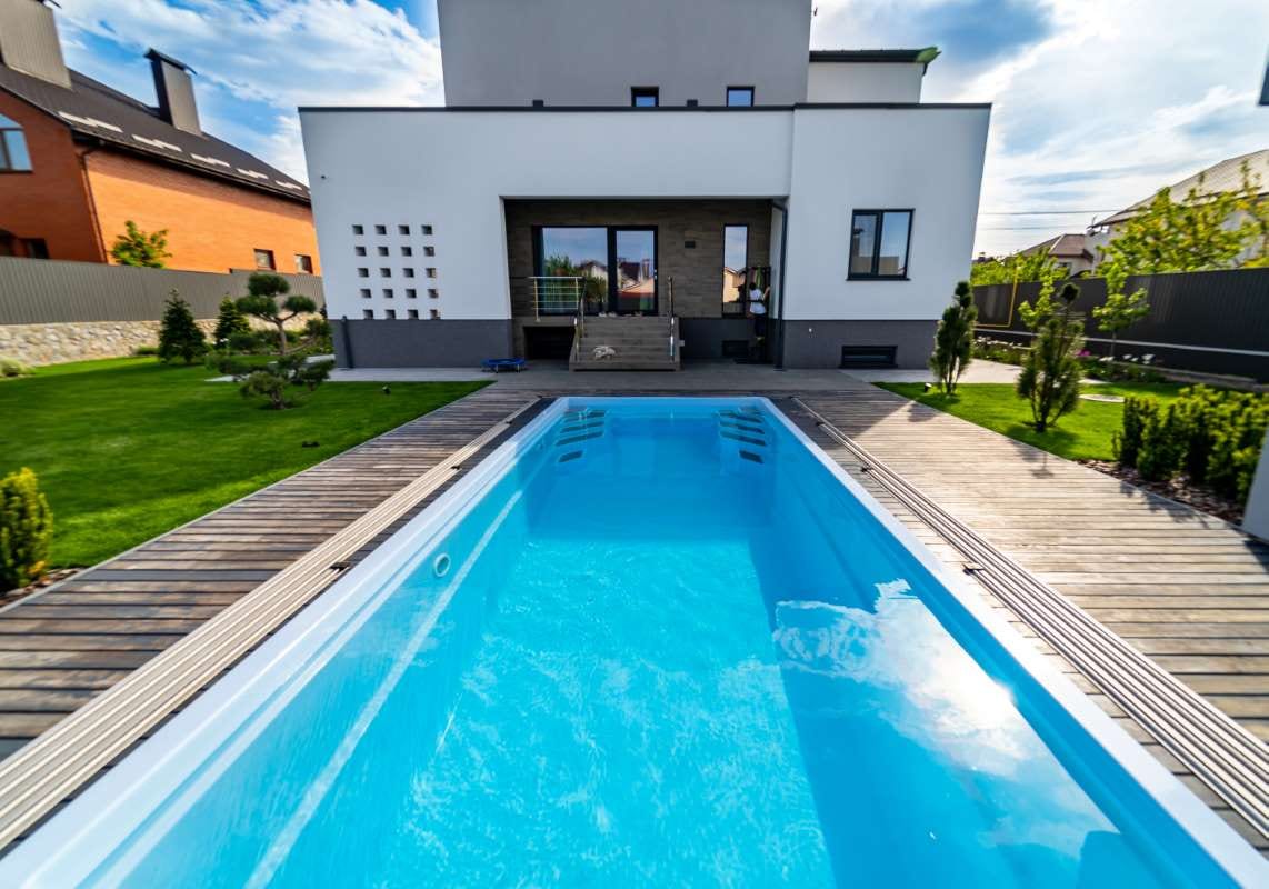 Luxurious house garden with a clean water pool and lush natural landscaping