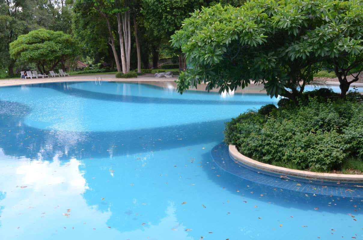 Close-up of blue pool water with ripples and reflections
