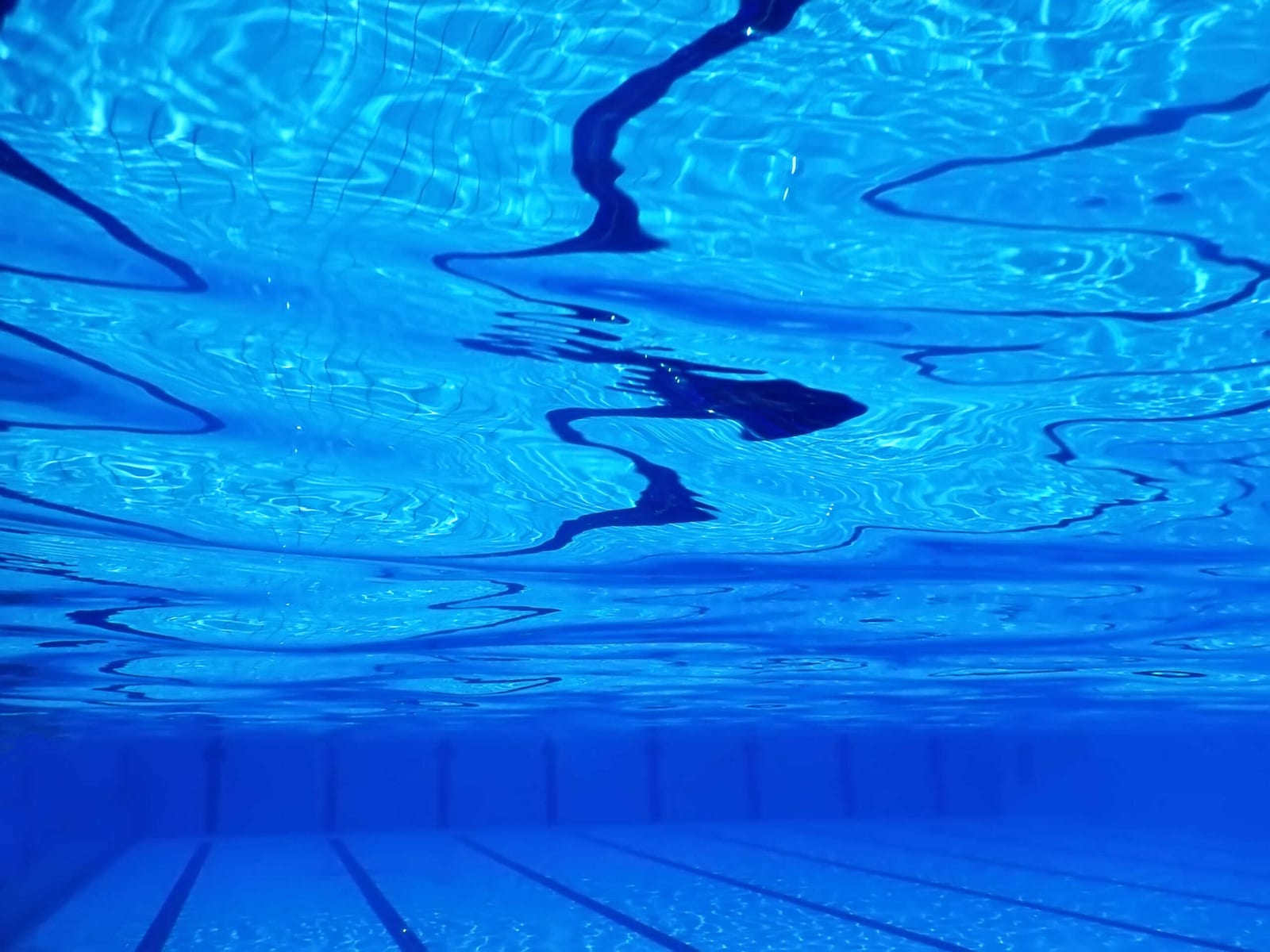 Underwater swimming pool water background for pool service teamwork accountability